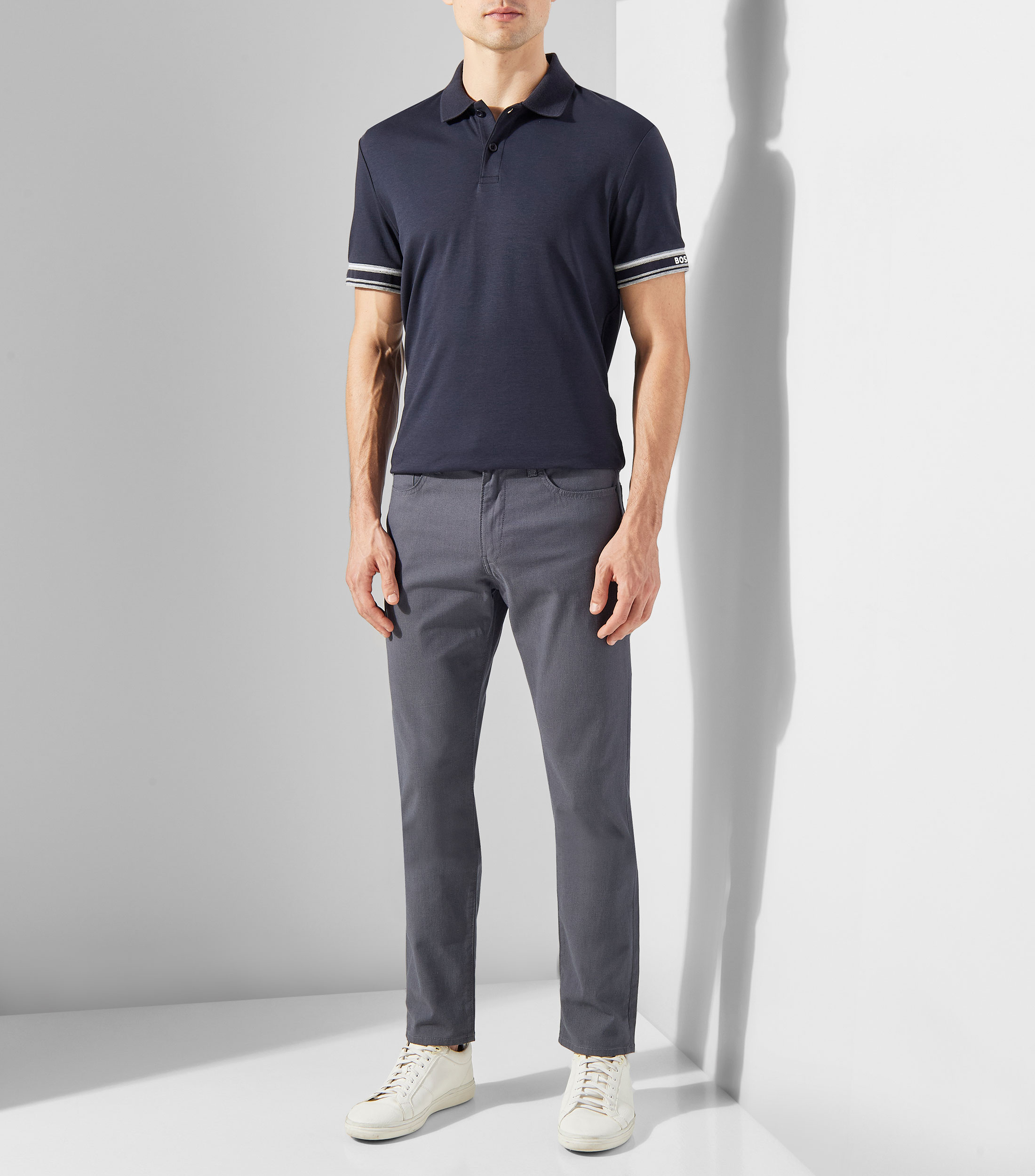 Playera tipo Polo slim fit de algodón con puños a rayas Hombre